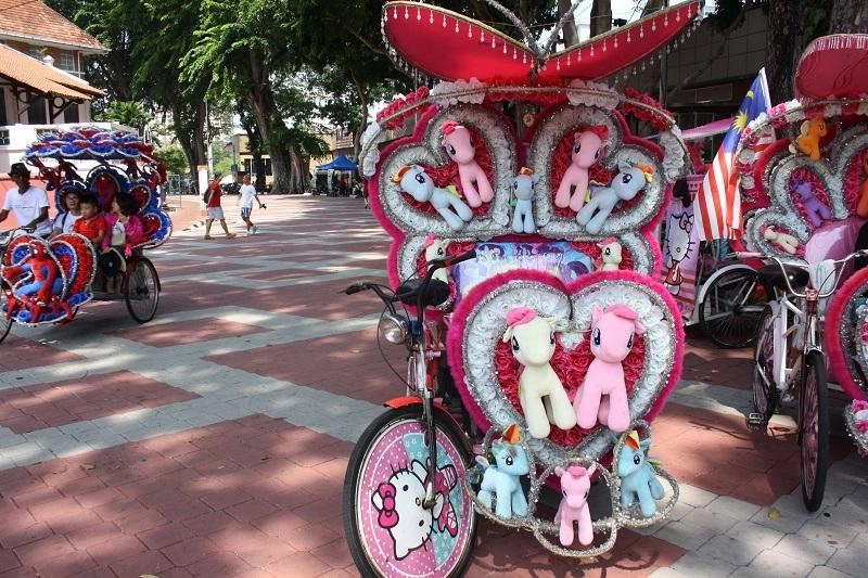 coloured cycle rickshaws in melaka