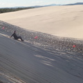 Sliding down sand dunes at Port Stephens